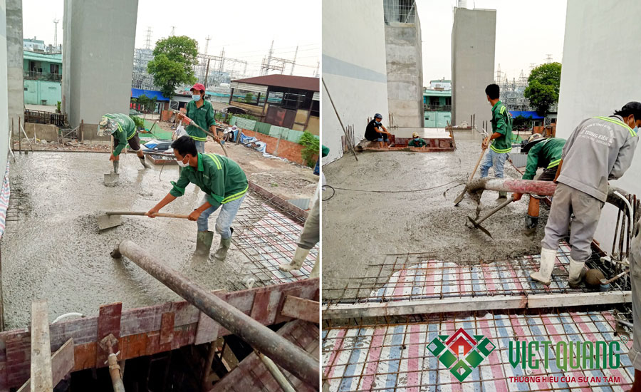 Công nhân Việt Quang thi công đổ bê tông sàn và sử dung đầm rung để tránh bị rổ bê tông